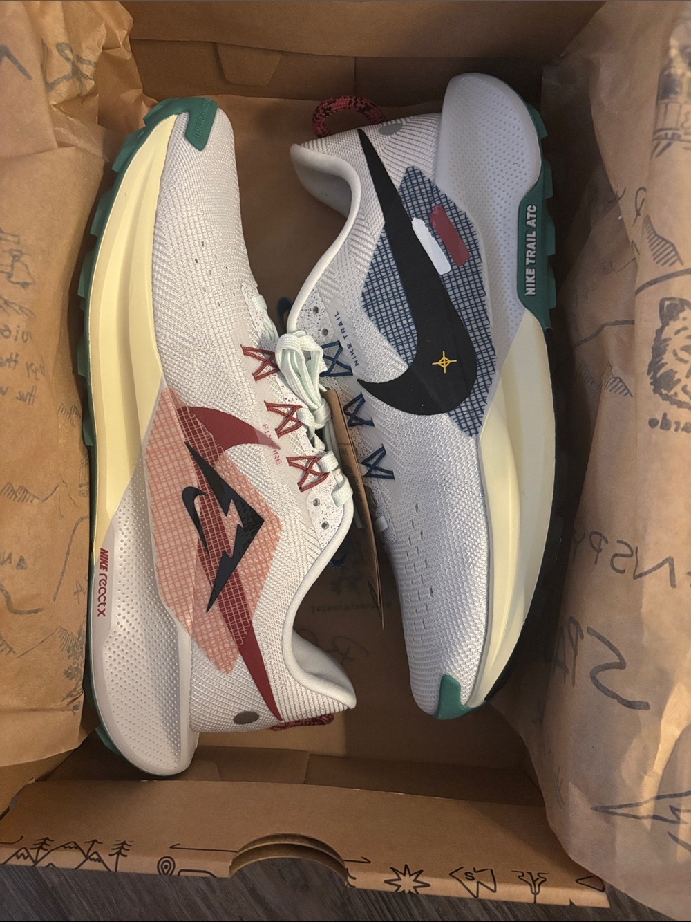 Nike women’s White Trail Sneakers with Teal and Red Accents